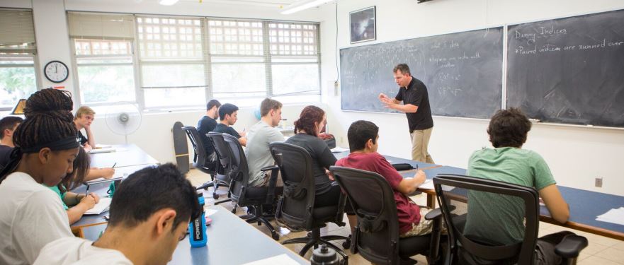 Professor lecturing to students in classroom