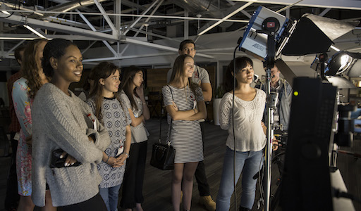 Students in behind camera on set