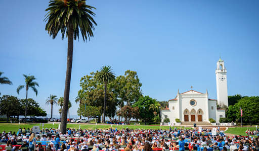Students at Orientation sitting in front of the chapel with their orientation groups