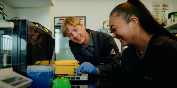 Dr. Willette and an LMU student work in a lab together.